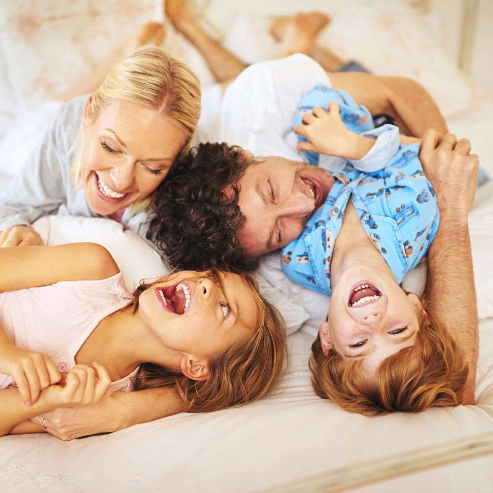 Happy Gold Coast family enjoying a cool home